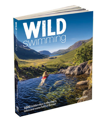 Book titled 'Wild Swimming Britian 3rd edition' with a scenic cover featuring a person swimming in a lake surrounded by mountains.