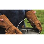 Robens Fire Gloves carrying a hot camp/dutch oven