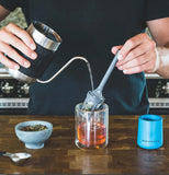 Barista & Co Brew It Stick Coffee and Tea Infuser in use making tea