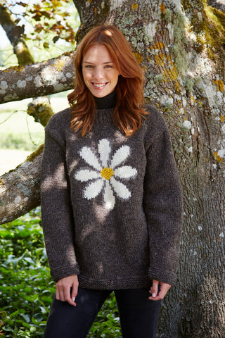 Model In Pachamama Daisy Sweater Bark Next to Tree