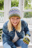 A woman wearing a Pachamama Finisterre Beanie in olive colourway