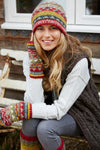 A woman wearing a Pachamama Finisterre Beanie in rust colourway