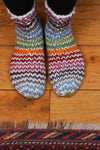 Pachamama Hoxton Stripe Sofa Socks on a wooden floor with rug