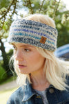 Pachamama Langtang Headband in Blue on an almost pouting blond haired model