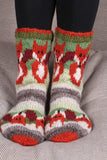Pachamama Skulk Of Foxes Sofa Socks showing the toes on a grey sofa