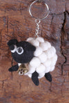 Pachamama Tessa the Bobbly Sheep Keyring shown with a natural wood background