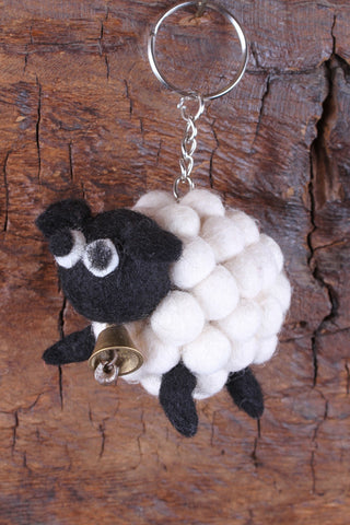 Pachamama Tessa the Bobbly Sheep Keyring shown with a natural wood background