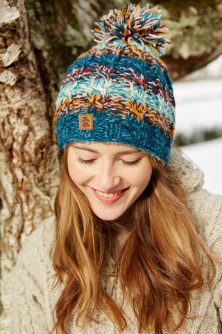 Pachamama Utrecht Bobble Beanie in the colour Blue The Hat to Smile In
